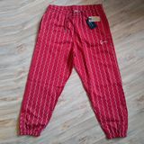 Tepláky Karl Kani Small Signature Ziczac Pinstripe Relaxed Fit Sweatpants dark red/off white